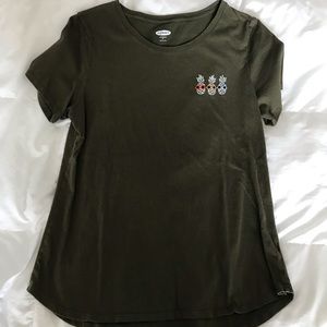 green tshirt with pineapples